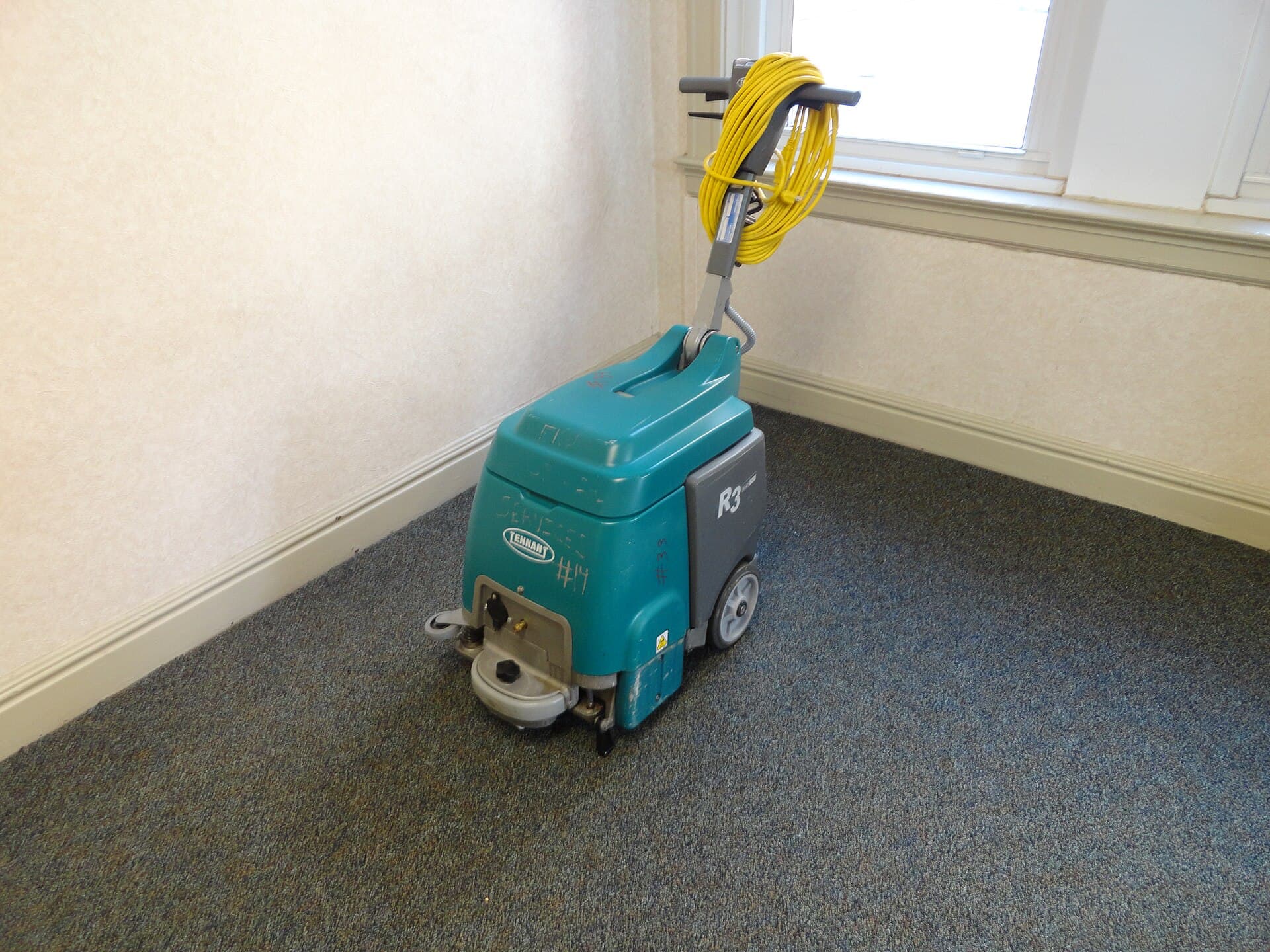 A carpet extractor in a hallway